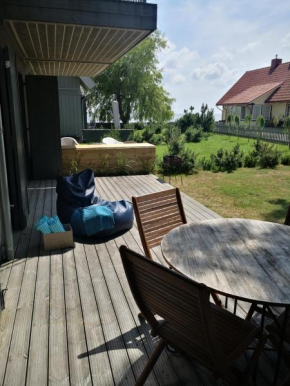 Cozy 1-bedroom lagoon apartment with free parking space Pervalka